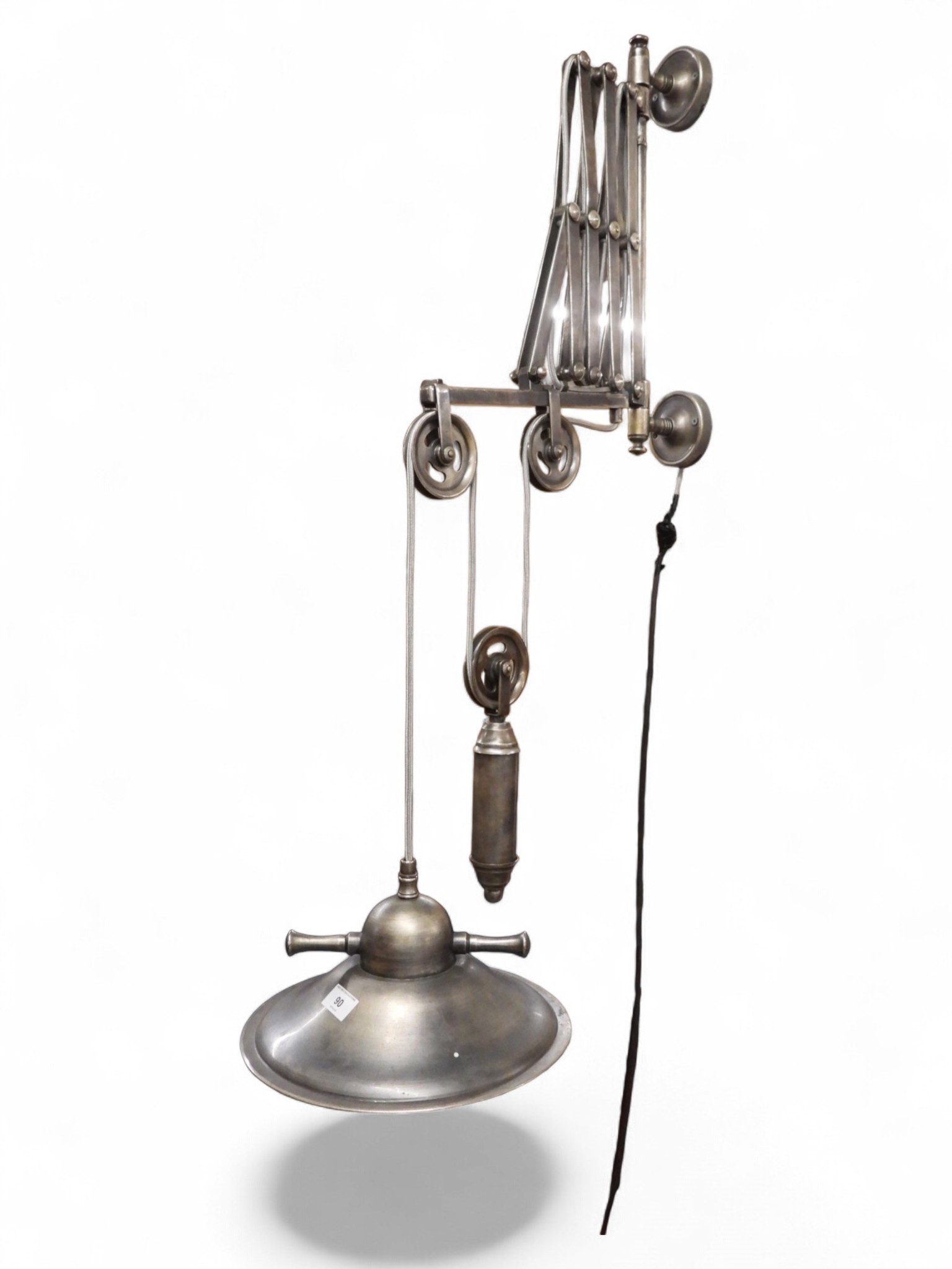 A contemporary industrial style scissor wall mounted light fixture with ...