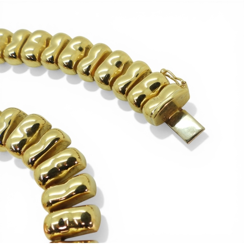 2700 - AN ITALIAN MADE NECKLACEmade in 18ct gold, the statement fringe necklace is 41.5cm long and 1.2cm wi... 