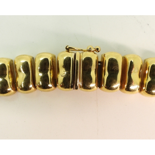2700 - AN ITALIAN MADE NECKLACEmade in 18ct gold, the statement fringe necklace is 41.5cm long and 1.2cm wi... 