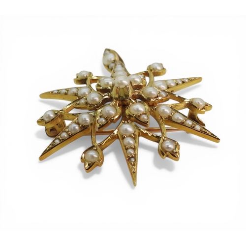 2704 - A PEARL STAR PENDANT BROOCHmade in 15ct gold and set throughout with split pearls, with removable ha... 