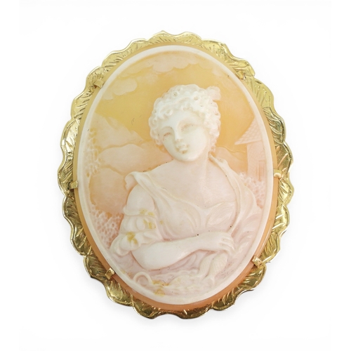 2705 - A SHELL CAMEO BROOCHmounted in 14k gold, with London import marks for 1975, the cameo finely carved ... 