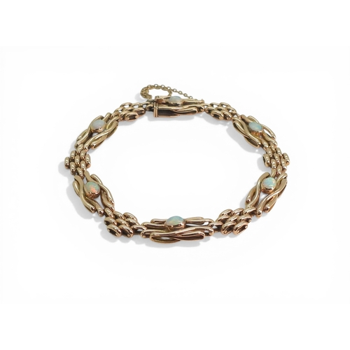 2706 - A VINTAGE OPAL BRACELETmade in 9ct rose gold, the knot shaped links set with oval opals of approx 4.... 