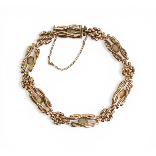 2706 - A VINTAGE OPAL BRACELETmade in 9ct rose gold, the knot shaped links set with oval opals of approx 4.... 