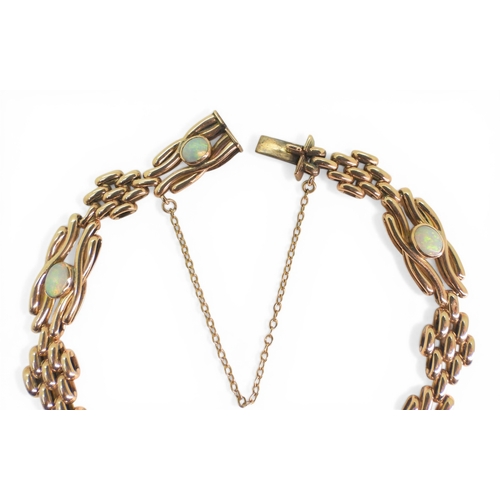 2706 - A VINTAGE OPAL BRACELETmade in 9ct rose gold, the knot shaped links set with oval opals of approx 4.... 