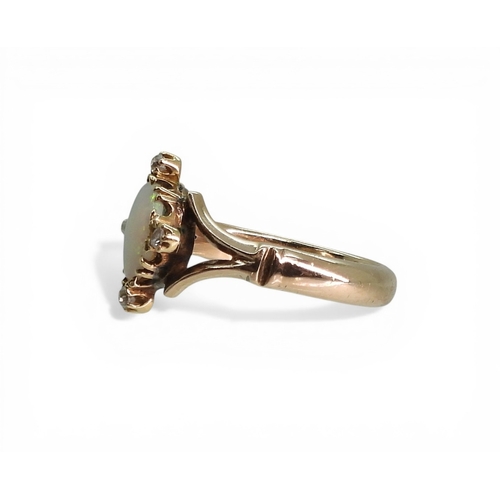 2707 - AN OPAL & DIAMOND RINGmade in 9ct rose gold, finger size N, weight 4.4gms