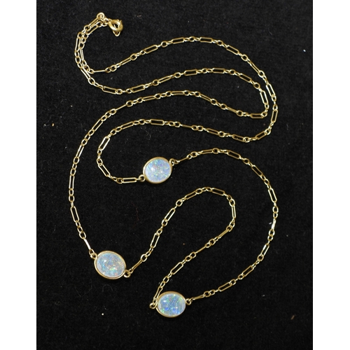 2708 - AN OPAL NECKLACEthe 18ct gold chain is hung with three spectacle set jelly opals of approx 10mm x 8m... 