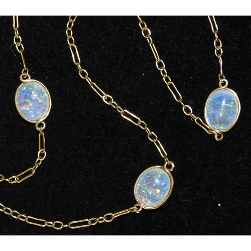 2708 - AN OPAL NECKLACEthe 18ct gold chain is hung with three spectacle set jelly opals of approx 10mm x 8m... 