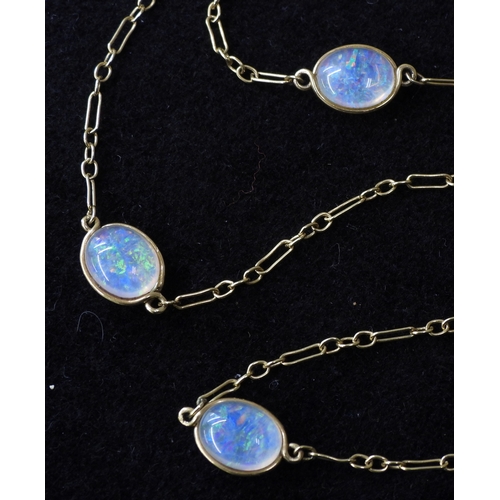 2708 - AN OPAL NECKLACEthe 18ct gold chain is hung with three spectacle set jelly opals of approx 10mm x 8m... 