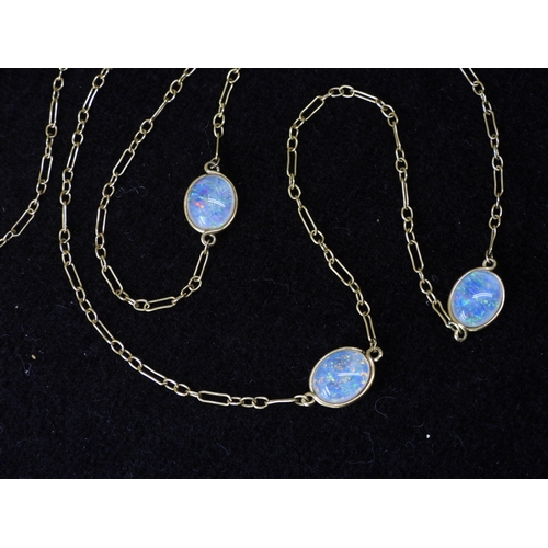 2708 - AN OPAL NECKLACEthe 18ct gold chain is hung with three spectacle set jelly opals of approx 10mm x 8m... 