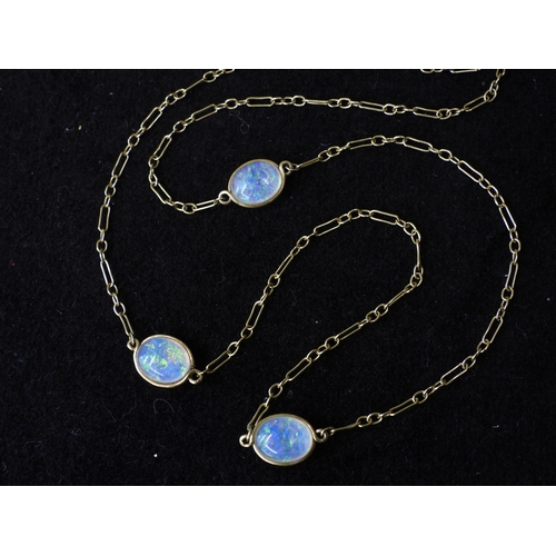 2708 - AN OPAL NECKLACEthe 18ct gold chain is hung with three spectacle set jelly opals of approx 10mm x 8m... 