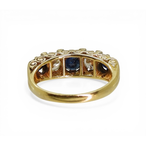 2712 - A SAPPHIRE & DIAMOND RINGwith a 18ct scroll mount, set with two estimated approx 0.20ct brillian... 