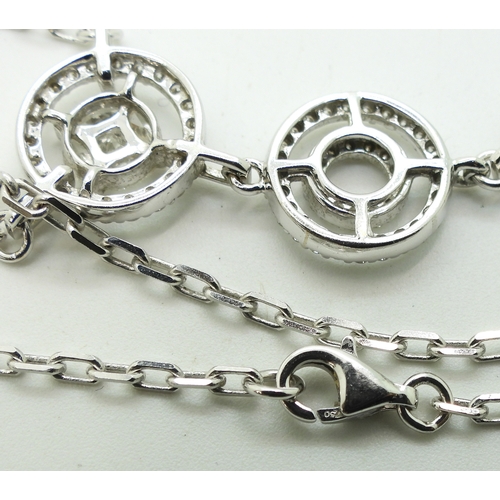 2715 - A DIAMOND NECKLACE made in 18ct white gold with a circles theme. set with brilliant cut, marquis cut... 