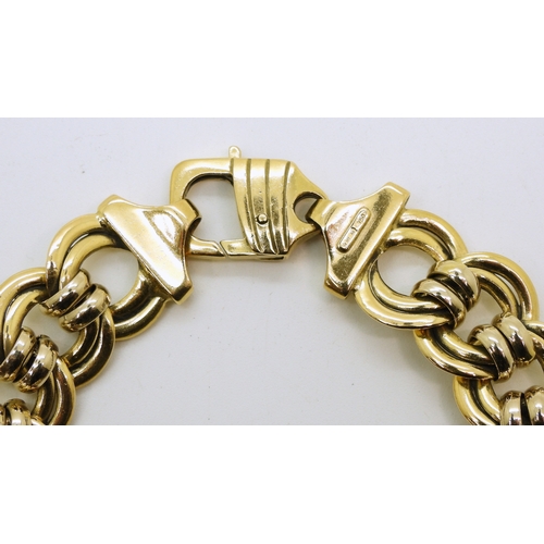 2717 - AN ITALIAN DESIGN BRACELETmade in 18ct yellow and white gold with a double link design. Length 20.5c... 