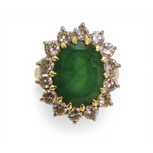 2721 - AN EMERALD & DIAMOND RINGmade in 18ct gold set with an oval cut emerald of approx 13mm x 10mm x ... 