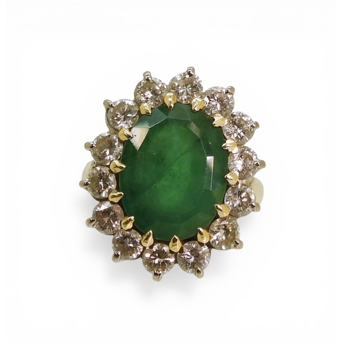 2721 - AN EMERALD & DIAMOND RINGmade in 18ct gold set with an oval cut emerald of approx 13mm x 10mm x ... 