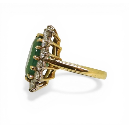 2721 - AN EMERALD & DIAMOND RINGmade in 18ct gold set with an oval cut emerald of approx 13mm x 10mm x ... 