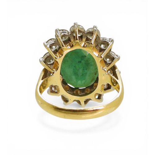 2721 - AN EMERALD & DIAMOND RINGmade in 18ct gold set with an oval cut emerald of approx 13mm x 10mm x ... 