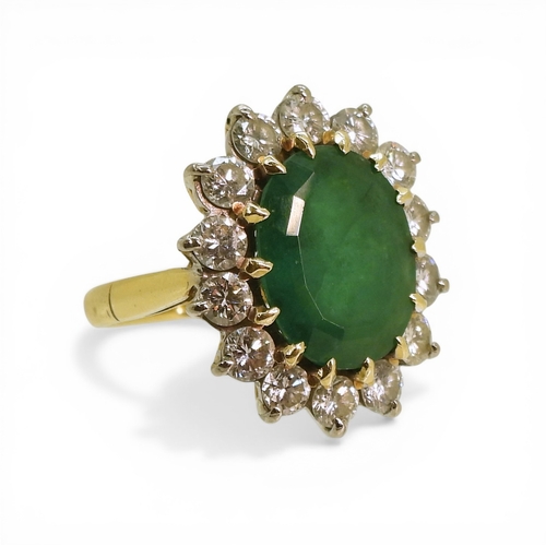 2721 - AN EMERALD & DIAMOND RINGmade in 18ct gold set with an oval cut emerald of approx 13mm x 10mm x ... 