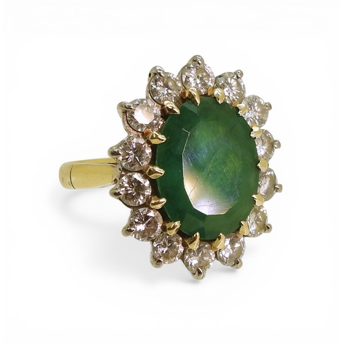 2721 - AN EMERALD & DIAMOND RINGmade in 18ct gold set with an oval cut emerald of approx 13mm x 10mm x ... 