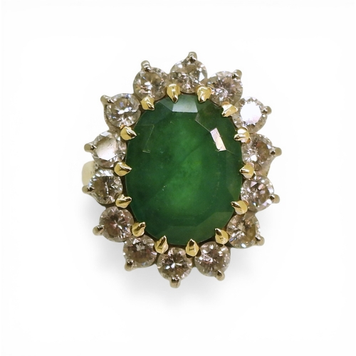 2721 - AN EMERALD & DIAMOND RINGmade in 18ct gold set with an oval cut emerald of approx 13mm x 10mm x ... 