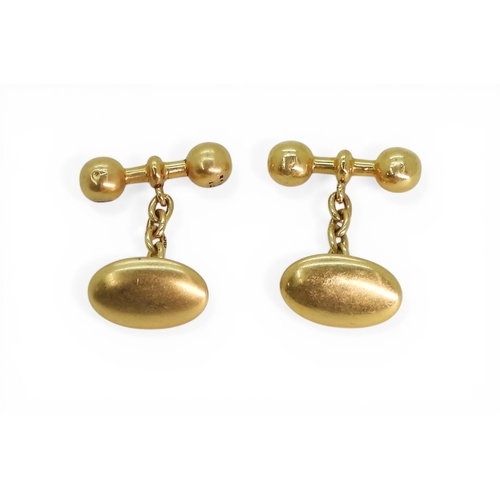 2723 - A PAIR OF VINTAGE CUFFLINKSmade in 18ct gold, with plain oval faces and ball ended baton linked with... 