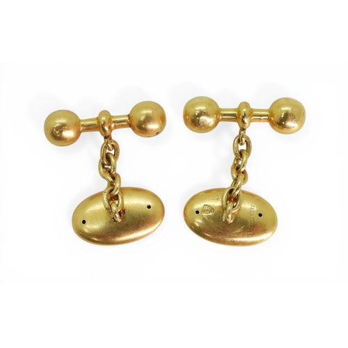 2723 - A PAIR OF VINTAGE CUFFLINKSmade in 18ct gold, with plain oval faces and ball ended baton linked with... 
