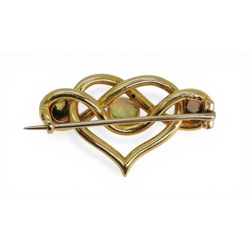 2726 - AN OPAL BROOCHmade in 15ct gold with a heart shaped lover's knot design, set with three fiery opals.... 