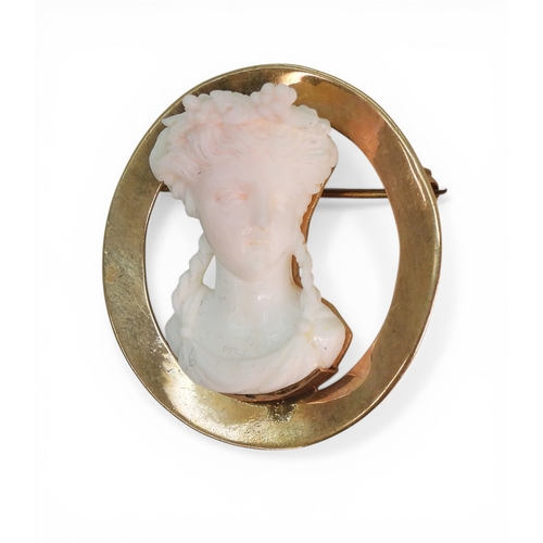 2727 - A CONCH SHELL CAMEO BROOCHunusually, deeply carved as a maiden in profile, mounted in 10k gold, diam... 