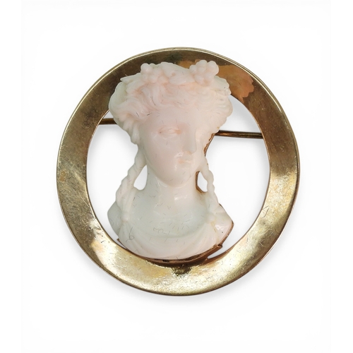 2727 - A CONCH SHELL CAMEO BROOCHunusually, deeply carved as a maiden in profile, mounted in 10k gold, diam... 