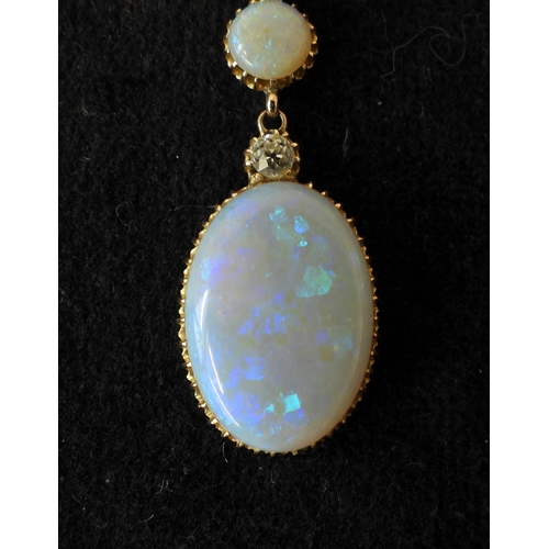 2733 - AN OPAL PENDANTthe mount is finely wrought in yellow metal, with galleried mounts and cut back setti... 
