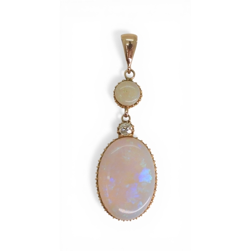 2733 - AN OPAL PENDANTthe mount is finely wrought in yellow metal, with galleried mounts and cut back setti... 