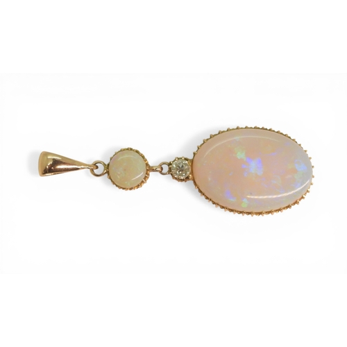 2733 - AN OPAL PENDANTthe mount is finely wrought in yellow metal, with galleried mounts and cut back setti... 