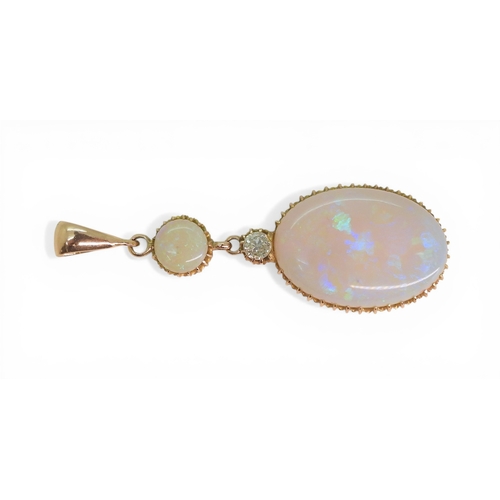 2733 - AN OPAL PENDANTthe mount is finely wrought in yellow metal, with galleried mounts and cut back setti... 