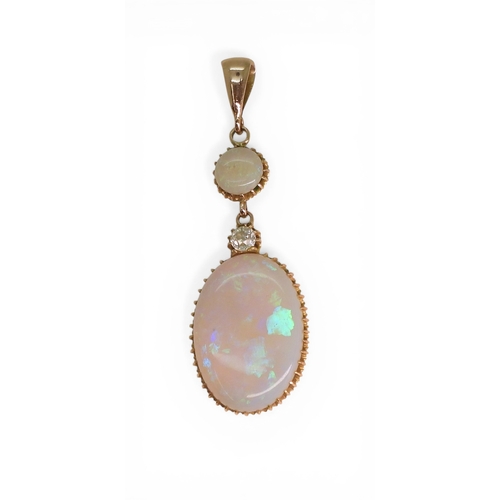 2733 - AN OPAL PENDANTthe mount is finely wrought in yellow metal, with galleried mounts and cut back setti... 