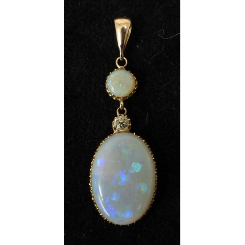 2733 - AN OPAL PENDANTthe mount is finely wrought in yellow metal, with galleried mounts and cut back setti... 
