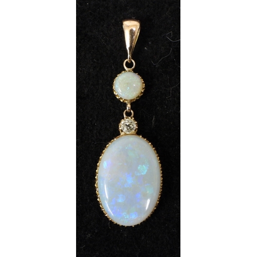 2733 - AN OPAL PENDANTthe mount is finely wrought in yellow metal, with galleried mounts and cut back setti... 