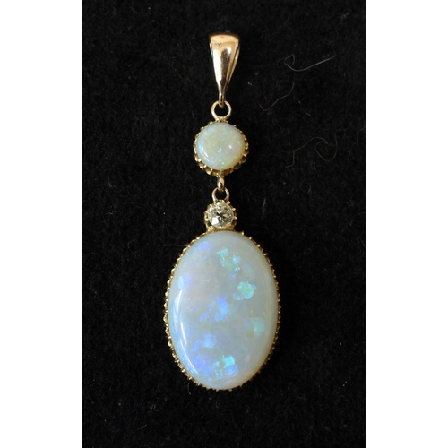 2733 - AN OPAL PENDANTthe mount is finely wrought in yellow metal, with galleried mounts and cut back setti... 