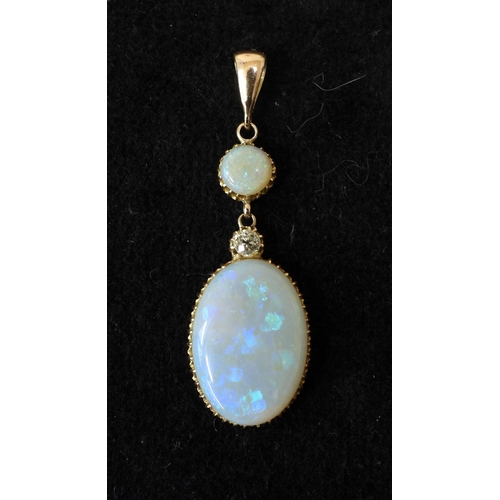 2733 - AN OPAL PENDANTthe mount is finely wrought in yellow metal, with galleried mounts and cut back setti... 