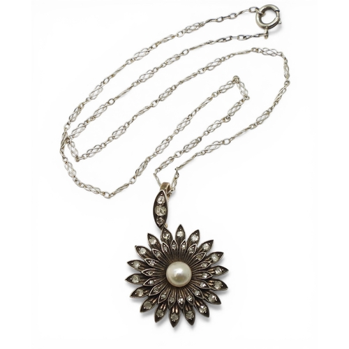 2740 - AN EDWARDIAN DIAMOND & PEARL PENDANT the flower pendant is made in yellow and white metal and se... 