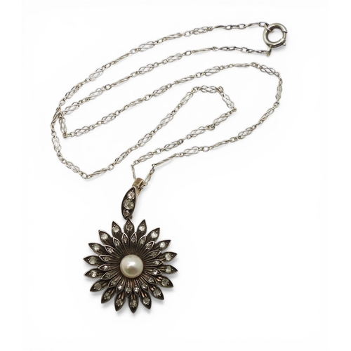 2740 - AN EDWARDIAN DIAMOND & PEARL PENDANT the flower pendant is made in yellow and white metal and se... 