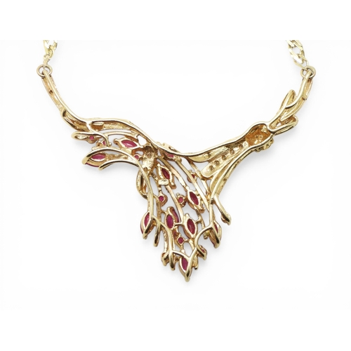 2741 - A RUBY & DIAMOND NECKLACEmounted in 9ct gold, the marquis and round cut ruby spray is enhanced w... 