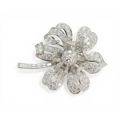 2743 - A DIAMOND FLOWER BROOCHcraftsman made in bright white metal, extensively set with brilliant cut and ... 