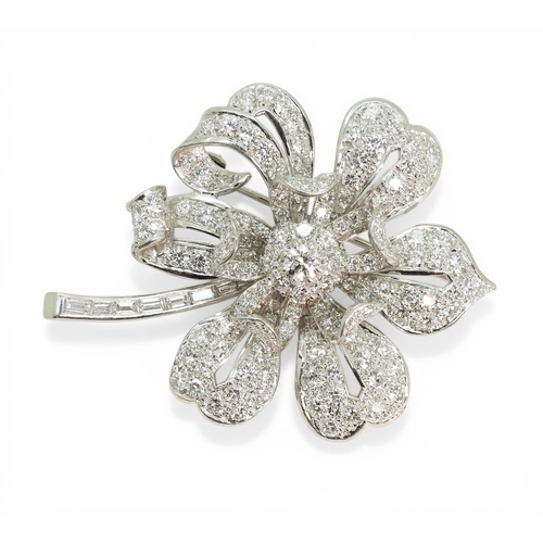 2743 - A DIAMOND FLOWER BROOCHcraftsman made in bright white metal, extensively set with brilliant cut and ... 