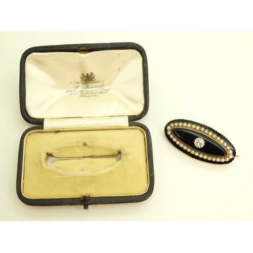2744 - A DIAMOND SET MOURNING BROOCHmounted in yellow metal with panels of onyx, black enamel and split pea... 
