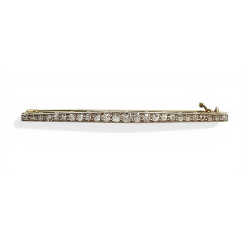 2746 - A DIAMOND BAR BROOCHhand made in bright yellow and white metal and set with old cut diamonds. Length... 