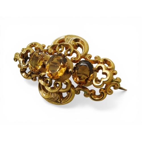 2749 - A VICTORIAN CITRINE BROOCHmade in bright yellow metal and set with three oval cut orange citrines. L... 