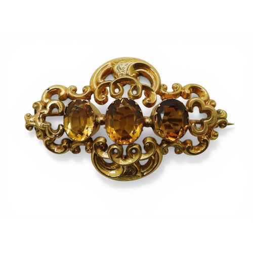 2749 - A VICTORIAN CITRINE BROOCHmade in bright yellow metal and set with three oval cut orange citrines. L... 