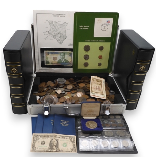 5011 - A worldwide coin collection together with an assortment of banknotes and two coin collector book fol... 