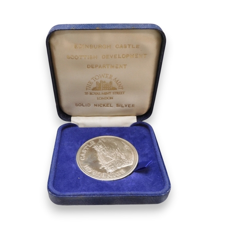 5011 - A worldwide coin collection together with an assortment of banknotes and two coin collector book fol... 
