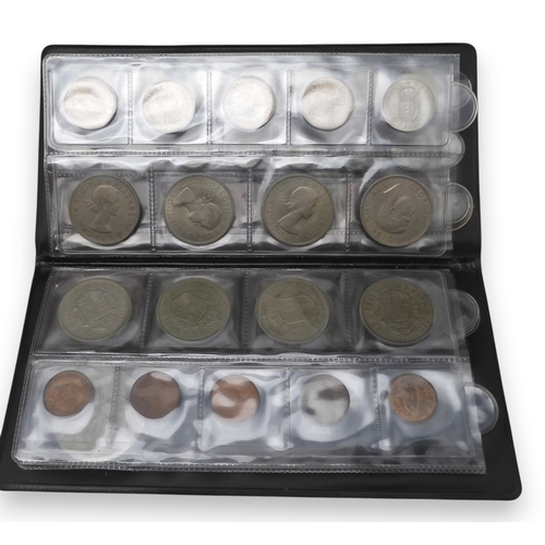 5011 - A worldwide coin collection together with an assortment of banknotes and two coin collector book fol... 